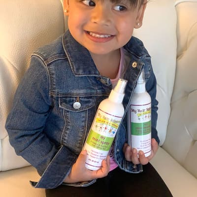 Happy, lice-free child at My Hair Helpers